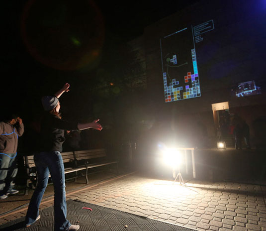 Tweetris is a Kinect-based outdoor game projected onto buildings. Phone courtesy Dalhousie University.